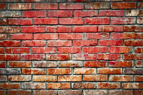 Old brick wall background image. Weathered texture of stained old dark brown and red brick wall, grungy obsolete blocks of stone-work technology