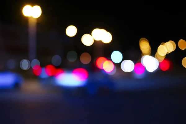 Retro toned blurred street and car lights, urban abstract night time background
