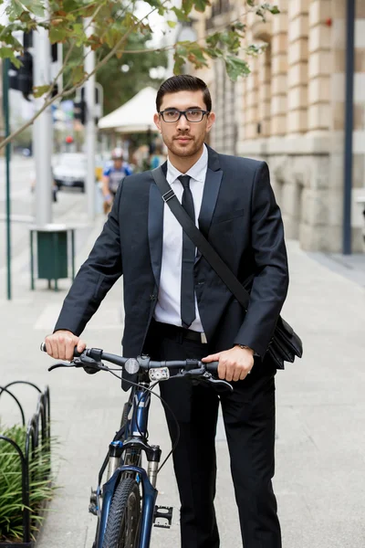 Young businessmen with a bike