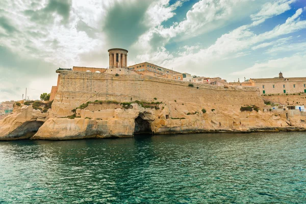 Beautiful view of Valletta fort wall from water