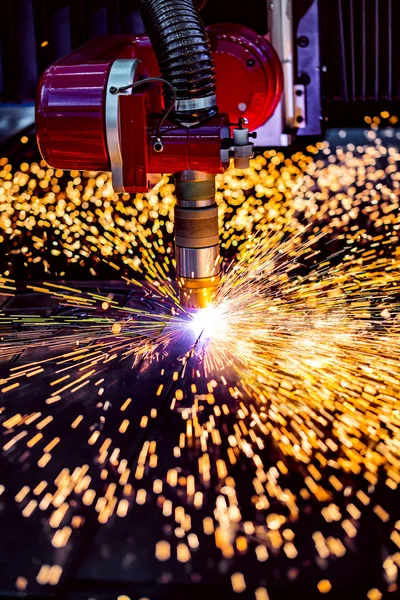 CNC Laser plasma cutting of metal, modern industrial technology.