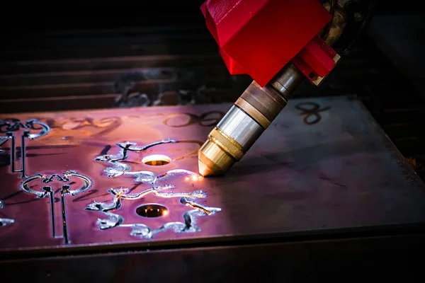 CNC Laser plasma cutting of metal, modern industrial technology.