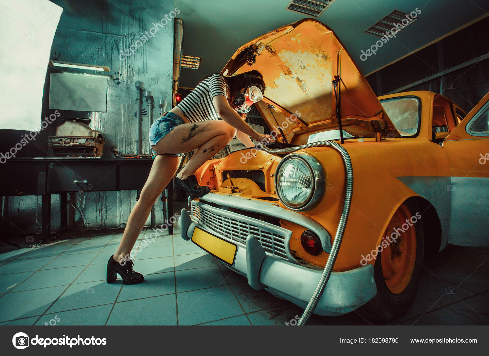 Sexy Woman Is Welding Something Inside An Old Car Stock 23870 Hot Sex Picture picture