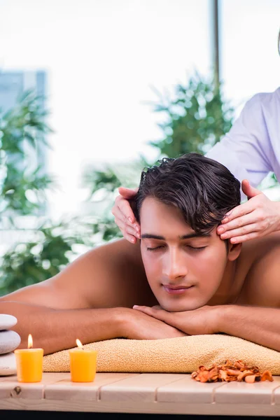 Man during massage session in spa salon