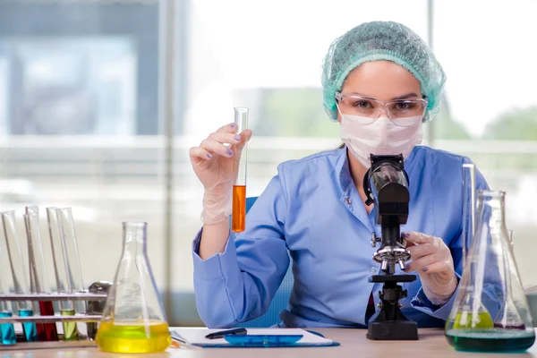 Woman chemist working in the lab