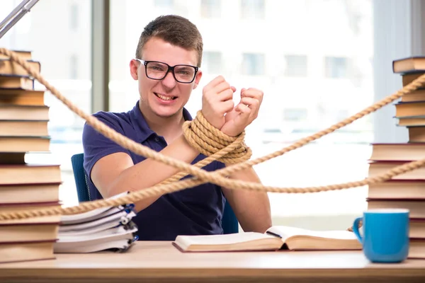 Young student forced to study tied