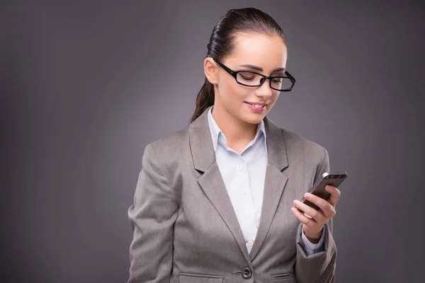 Businesswoman texting and sending text messages