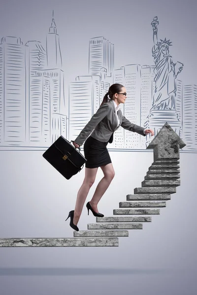 Businesswoman climbing career ladder concept