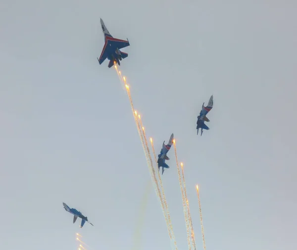 Aircraft Sukhoi Su-27 of the Military Air forces Russia perform aerobatics at an Airshow Russian Knights