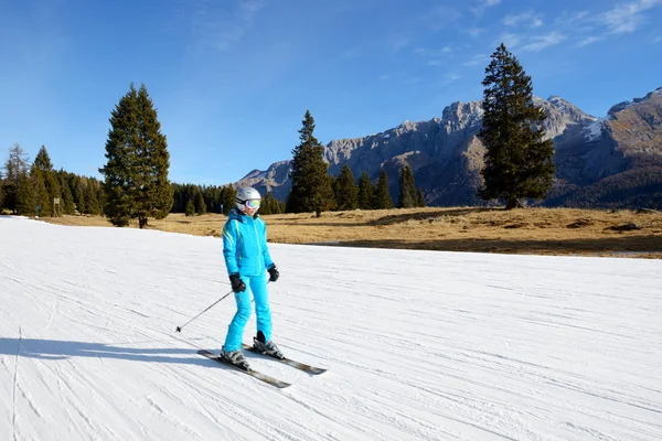 MADONNA DI CAMPIGLIO, ITALY - DECEMBER 18: The ski slope and skier at Passo Groste ski area on December 18, 2015 in Madonna di Campiglio, Italy. More then 46 mln tourists is expected to visit Italy in year 2015.