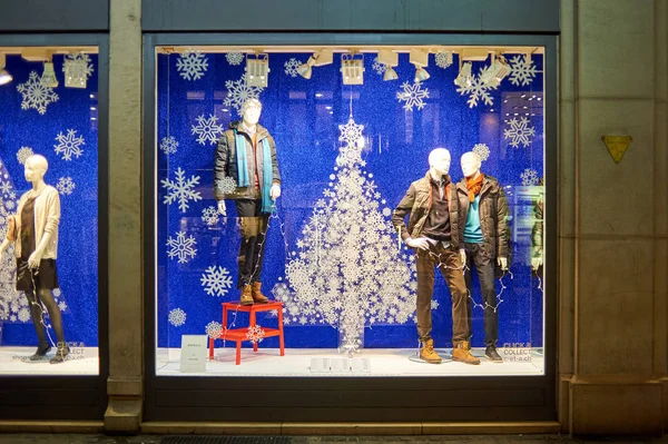 Christmas decorated shop window at night