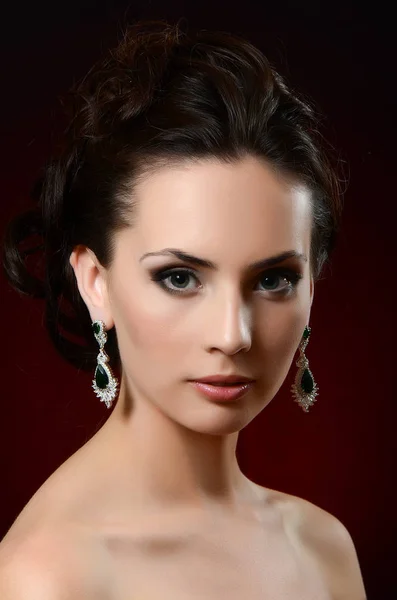 Beautiful woman in jewelry earrings