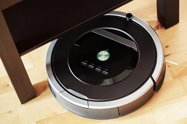 Robotic vacuum cleaner on laminate wood floor smart cleaning tec