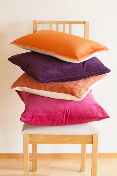 Colorful cushions on chair cozy home mood