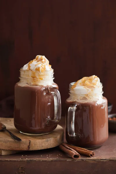 Hot chocolate with whipped cream caramel in mason jar