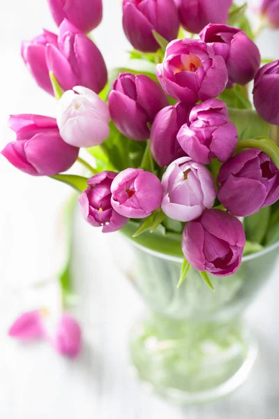 Beautiful purple tulip flowers bouquet in vase