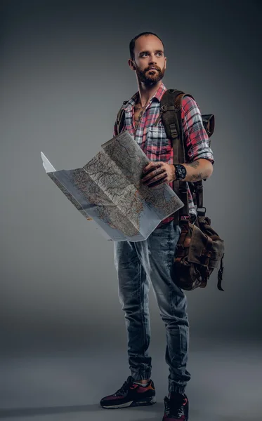 Tourist male holding city map
