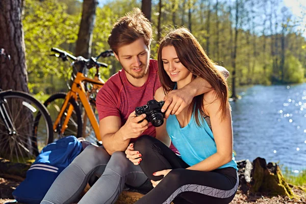 Man showing pictures to his girlfriend