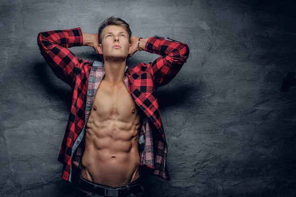 Fashionable abdominal male in a red shirt.