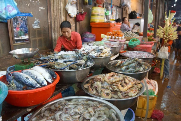 Woman selling fish  in  Siem Reap