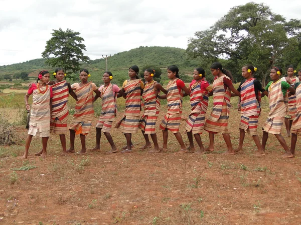Tribal women link arms