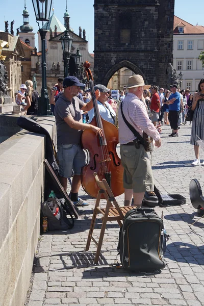 Street musicians play on the Charles Bridge