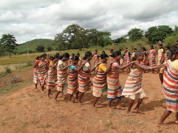 Tribal women link arms