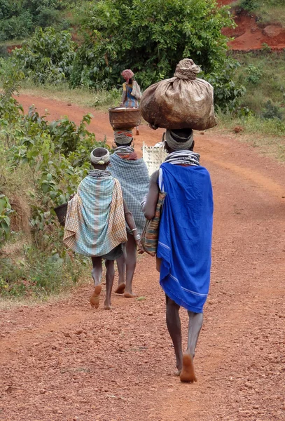 Bonda tribal women carry trade goods