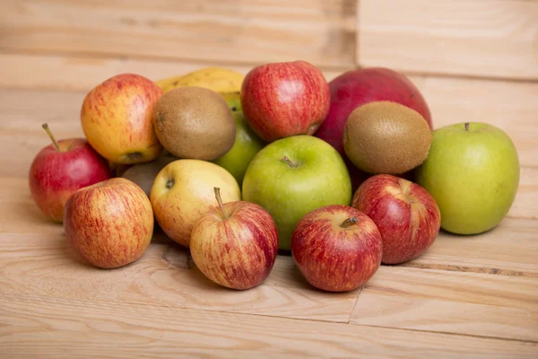 Variety of fruits on a wooden table, studio picture