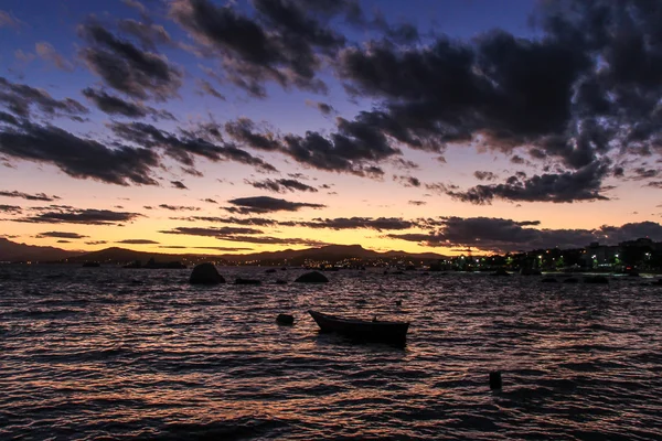 Little boat at sunset.