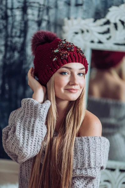 Young  woman with makeup in hat