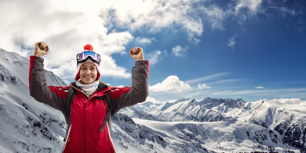 Woman in ski suit enjoying in winter holiday