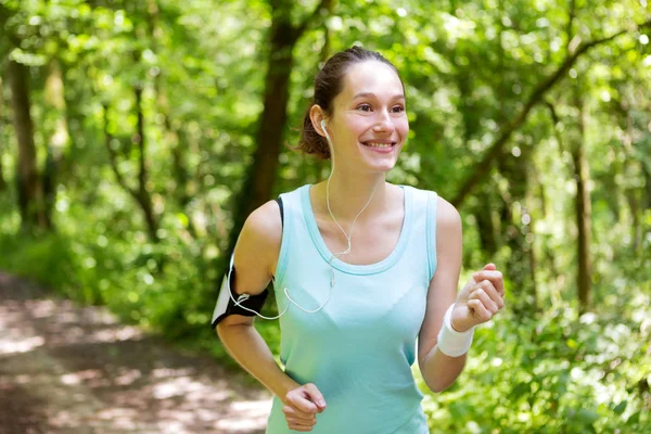 Woman running in forest