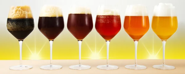 Six glasses with different beers