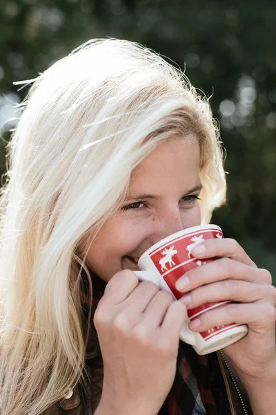 Woman drinking hot tea outdoor