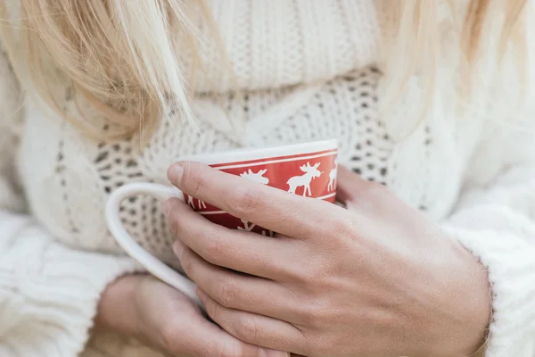 Woman drinking hot tea outdoor