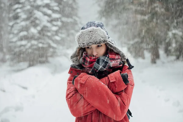 Winter portrait, young woman in winter forest