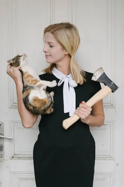 Creepy blond woman with axe  and cat