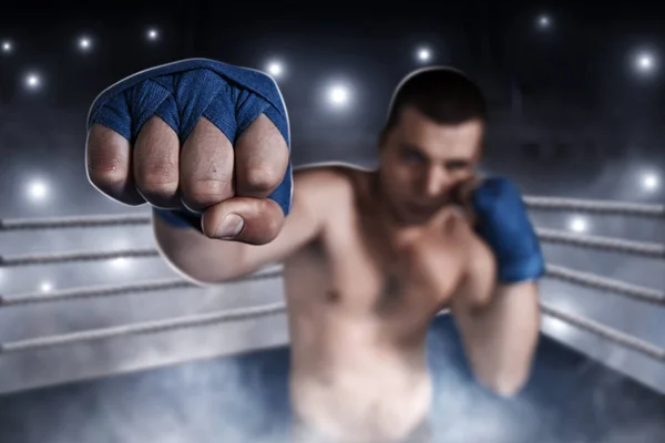 Boxer in blue wrist wraps training