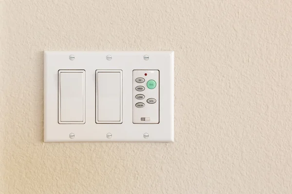 Light Switches and Fan Control on Wall