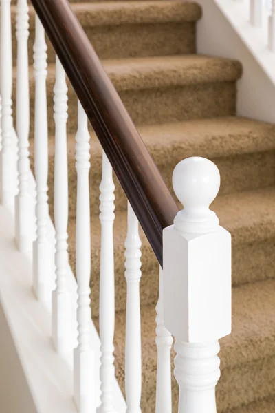 Abstract of Stair Railing and Carpeted Steps in House