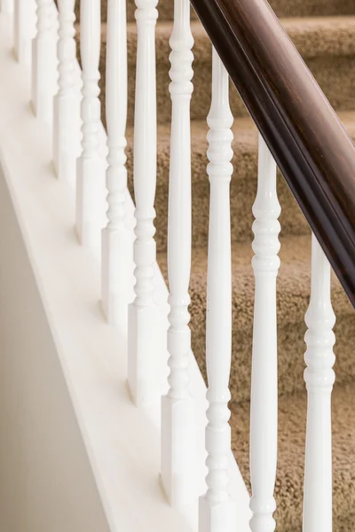 Abstract of Stair Railing and Carpeted Steps in House