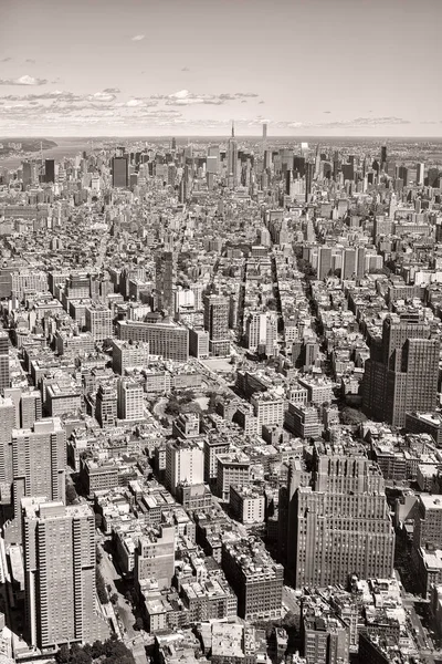 Black and white aerial view of New York City with the midtown sk