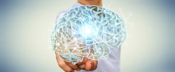 Businessman touching x-ray human brain with his finger