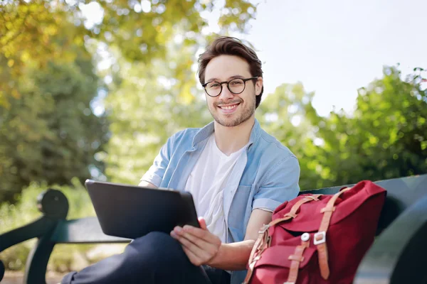 Man in glasses on a bench