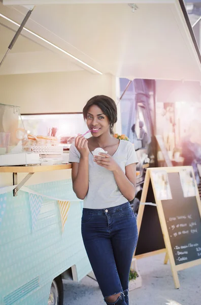 Black woman eating ice-cream