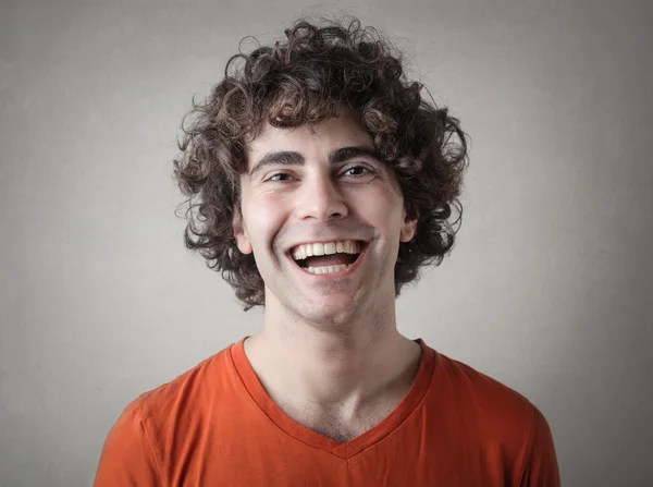 Laughing curly haired man