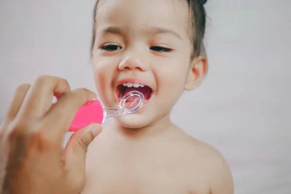 Open mouth of asia little girl during checking tooth and by dental mirror tools toy. Healthcare And Medicine Concept