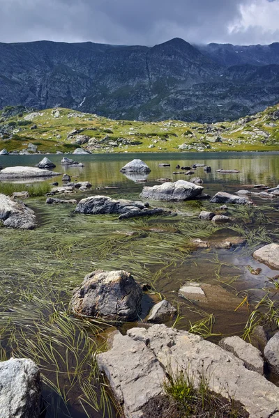 Stones in the water of The Trefoil lake, Rila Mountain, The Seven Rila Lakes
