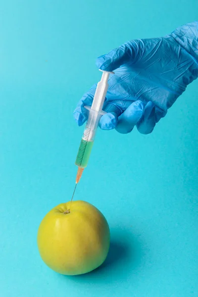 Chemical additives in food or genetically modified fruit concept